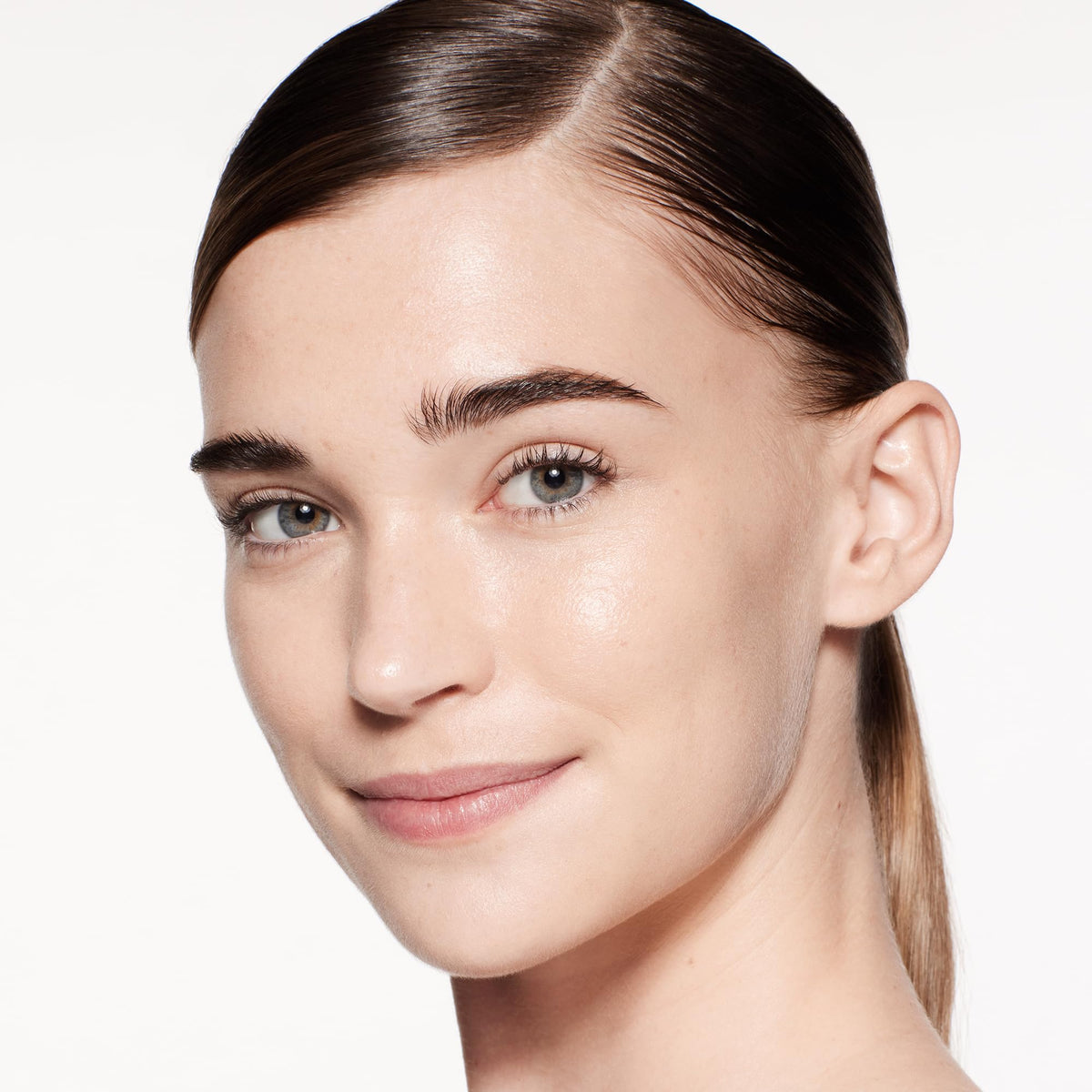 Shiseido RevitalEssence Skin Glow Foundation brush applying buildable coverage.