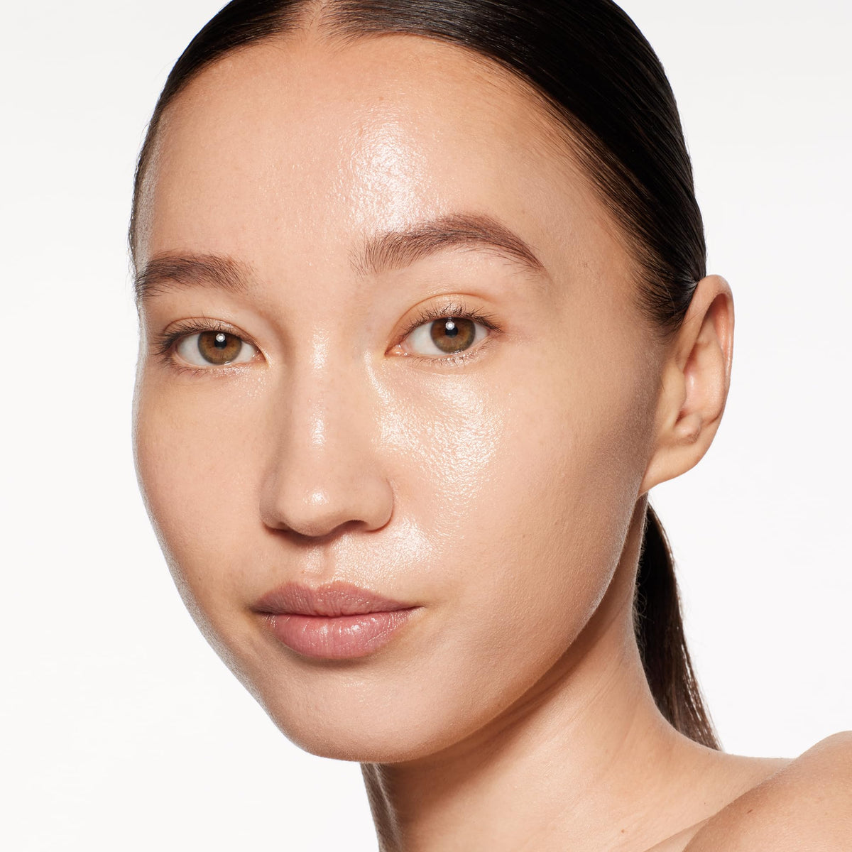 Shiseido RevitalEssence on bare skin reveals smoother, radiant look.