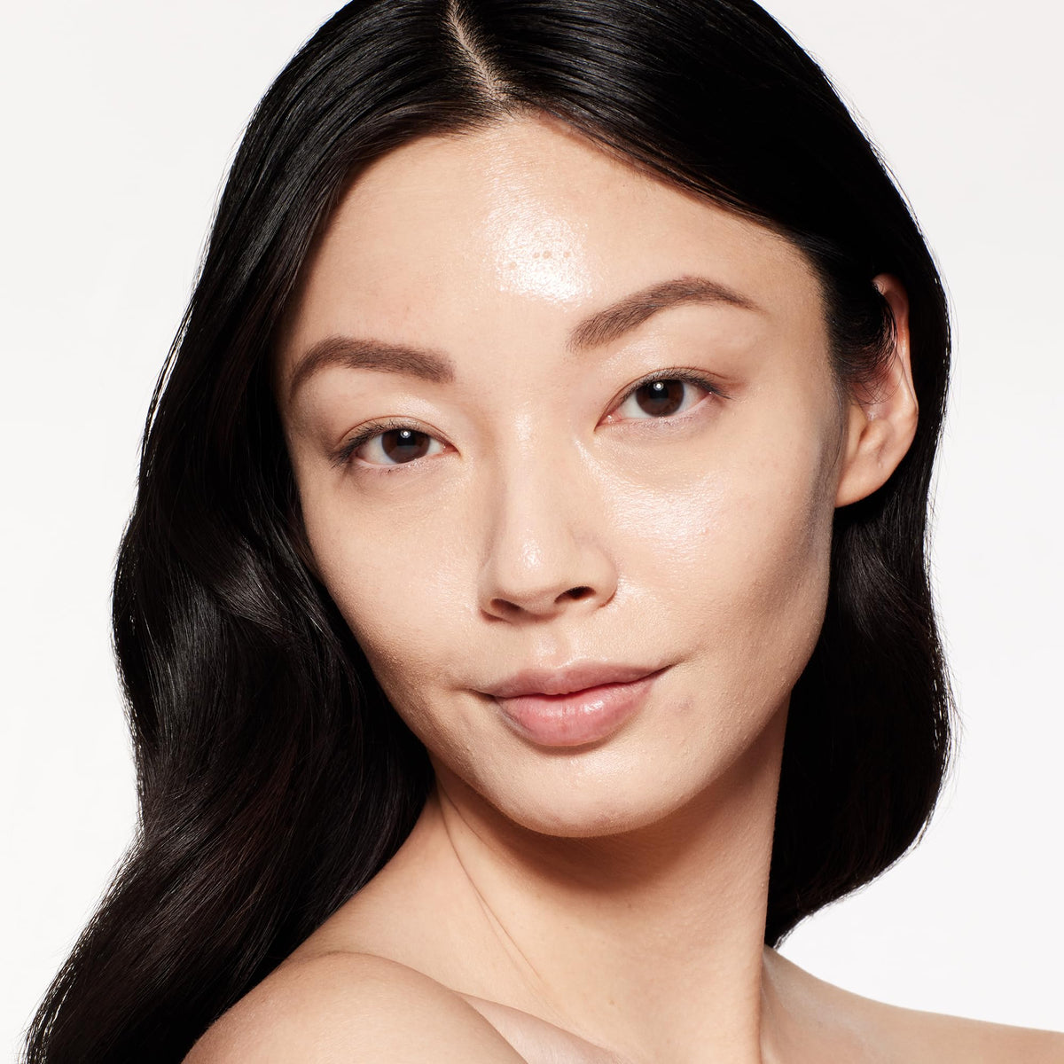 Shiseido foundation with brush blending evenly for a smooth look