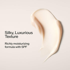 Spatula dispensing the Shiseido Vital Perfection day cream for precise, hygienic use.