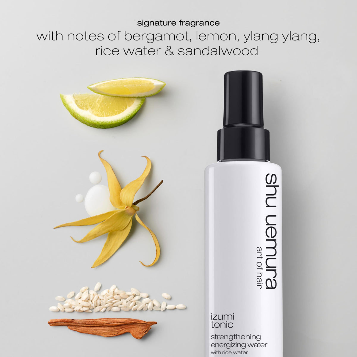 Spray-on application of shu uemura art of hair Izumi Tonic on damp hair for even distribution.