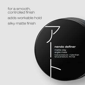 Close-up of Nendo Definer Pomade in hand shaping a textured look.