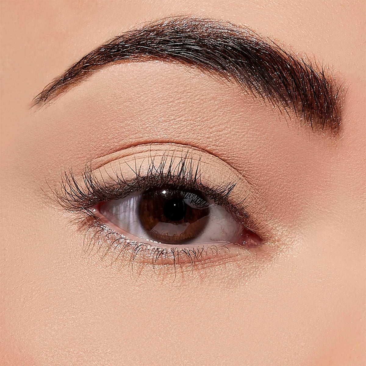Sigma Beauty Ignite primer packaging shows sleek design and compact application.