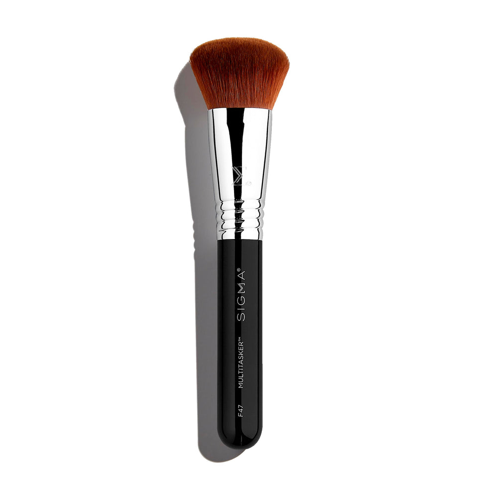Sigma Beauty F47 Multitasker brush applying foundation for a seamless base.