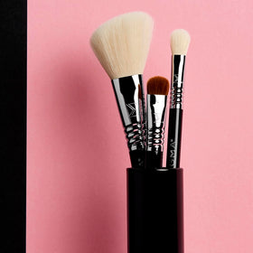 Brush tin closed from Sigma Beauty Travel Essential Trio for compact travel storage.