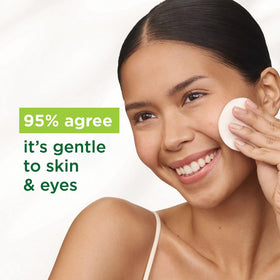 Applying Simple Micellar Water with cotton pad for makeup removal.