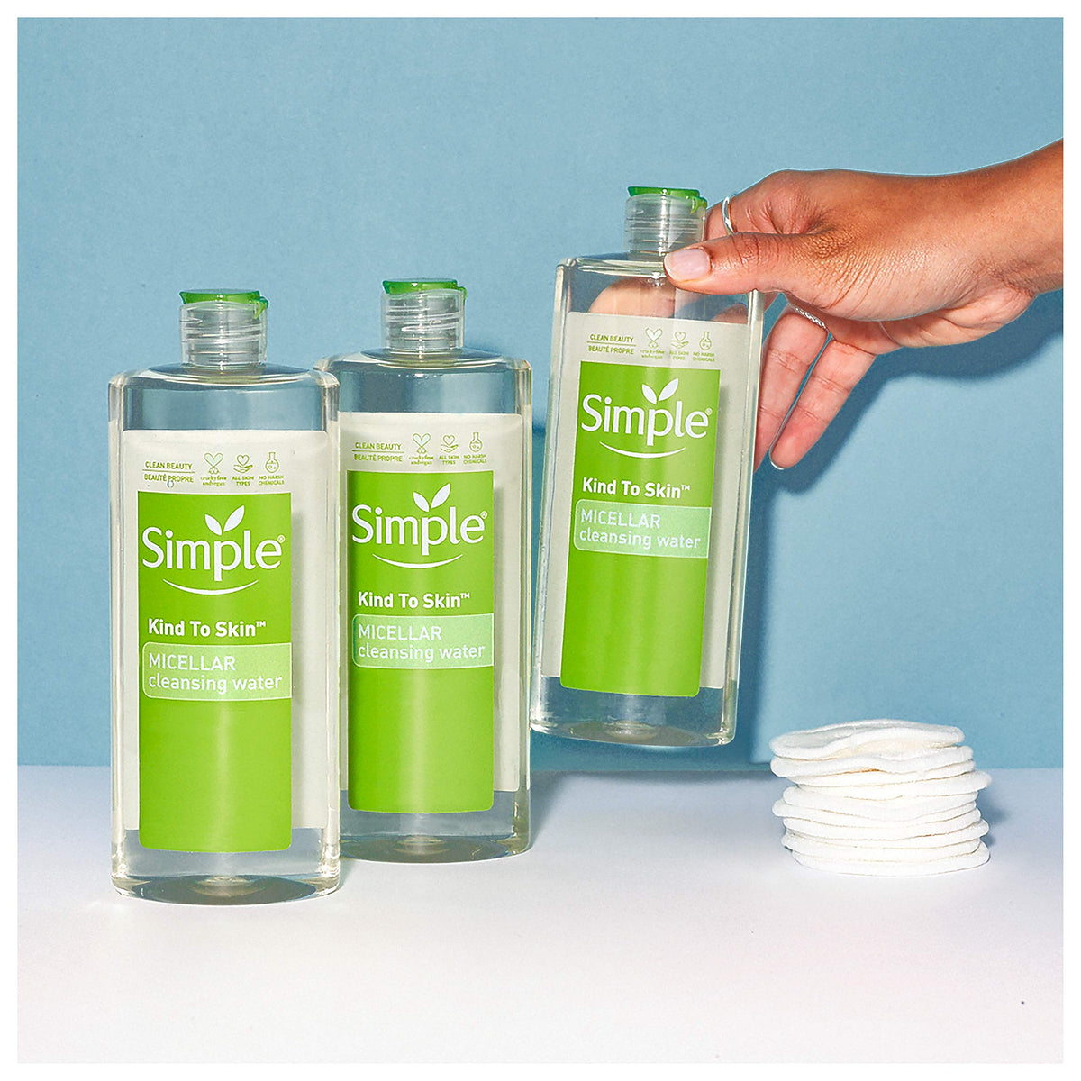 Simple Micellar Cleansing Water cotton round application demonstrating easy makeup removal.