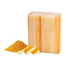 Orange Zest scented soap bar slice showcasing natural ingredients and moisturized skin feel