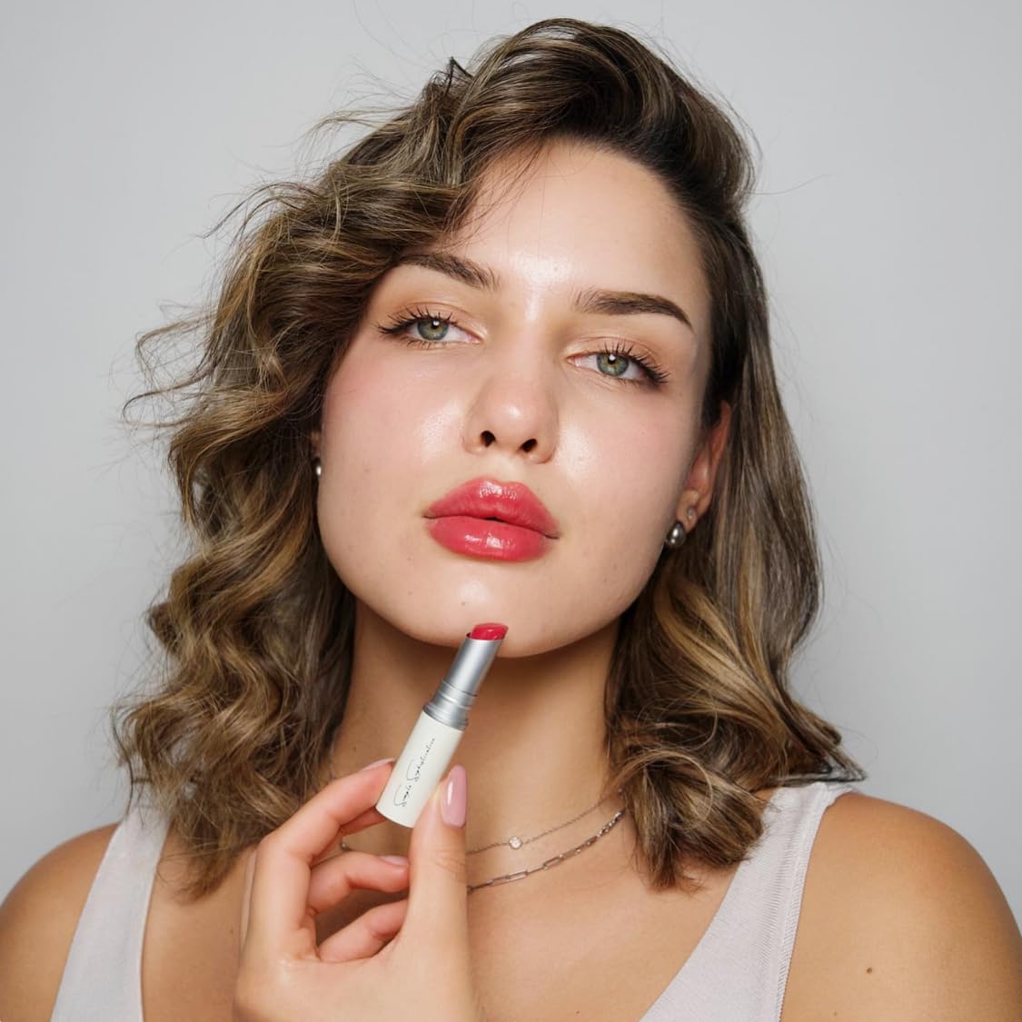 Simple Sophistication Natural Lip Balm ingredients show grass-fed tallow and argan oil for nourishment.