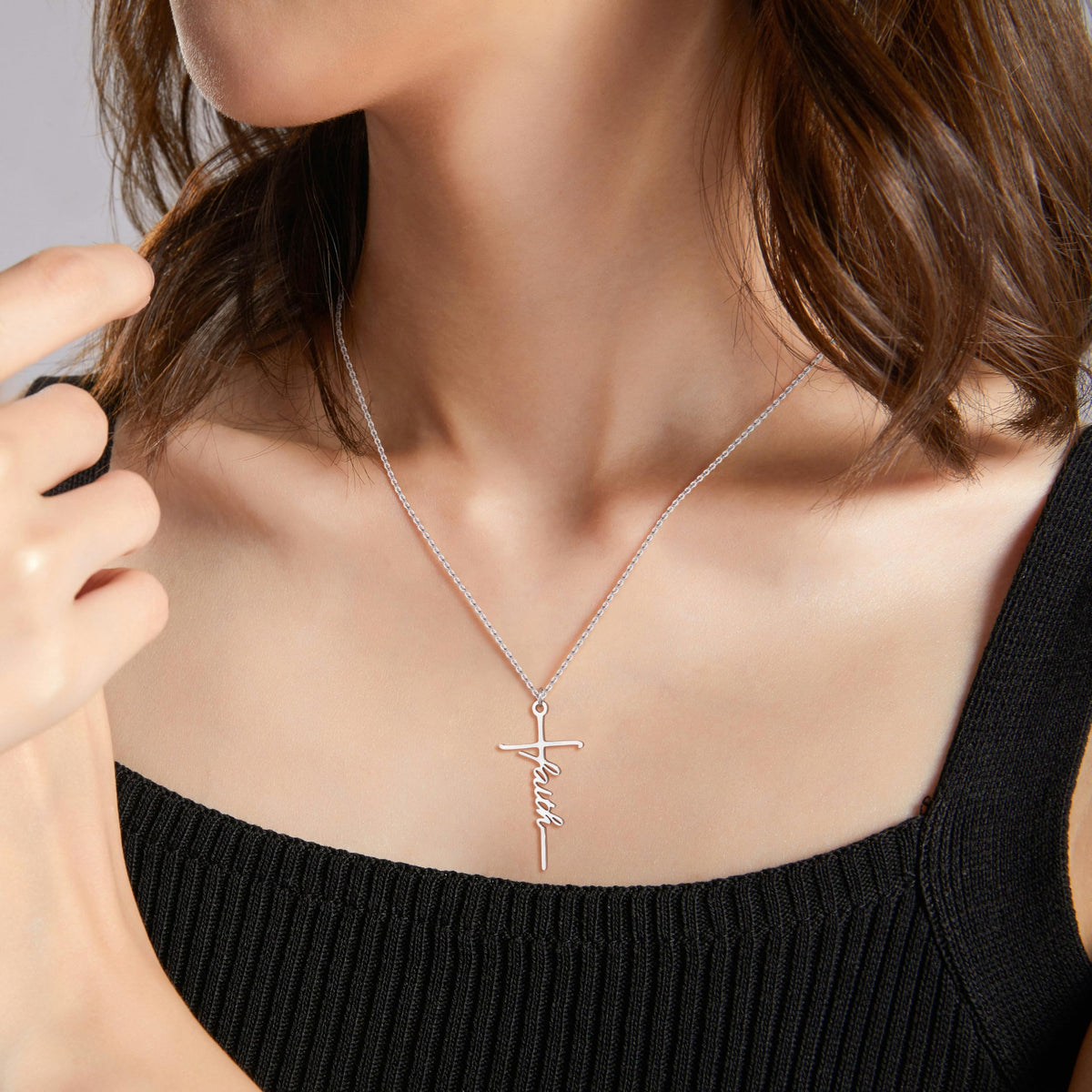 SiplyHaven FAITH cross necklace adds a delicate spiritual touch to outfits.