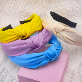 SIQUK knotted headbands yellow hue adds bright accent to looks.
