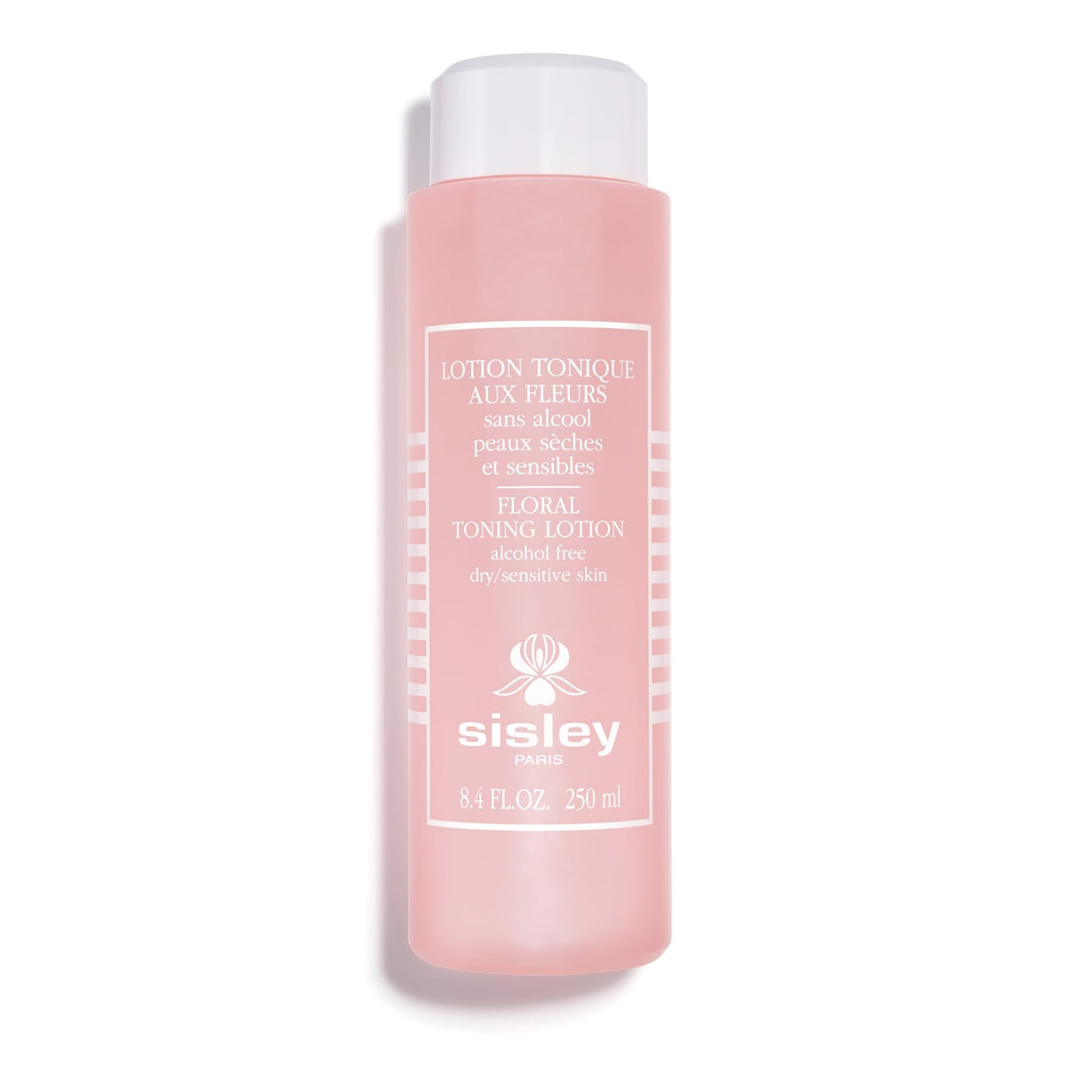 Sisley Paris Floral Toning Lotion bottle with cotton pad for gentle cleansing and toning.