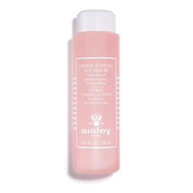 Sisley Paris Floral Toning Lotion bottle with cotton pad for gentle cleansing and toning.