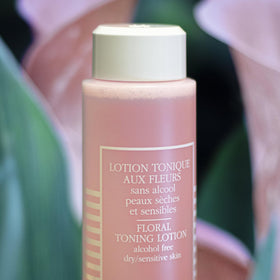 Illustration of rose, cornflower, and witch hazel hydrolats in the Floral Toning Lotion for sensitive skin.