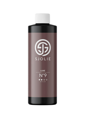 SJOLIE Violet Spray Tan Luxe 9 bottle front for a hydrating medium tan.