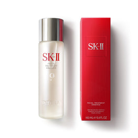 SK-II Facial Treatment Essence bottle pours hydration for glowing skin.