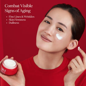 Dab and blend close-up demonstrates pearl-sized amount spreading evenly on skin.