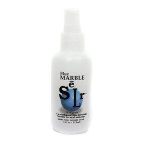 Skin Illustrator Blue Marble bottle pour demonstrates quick sealing for stage makeup durability.