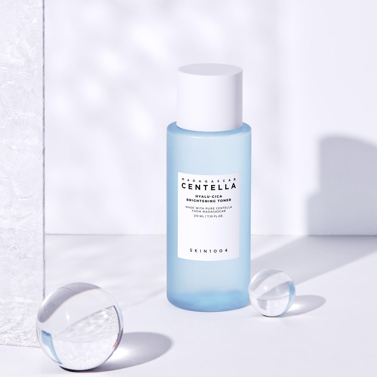SKIN1004 Hyalu-Cica Toner on cotton pad for gentle exfoliation prep.