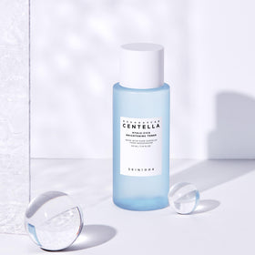 SKIN1004 Hyalu-Cica Toner on cotton pad for gentle exfoliation prep.