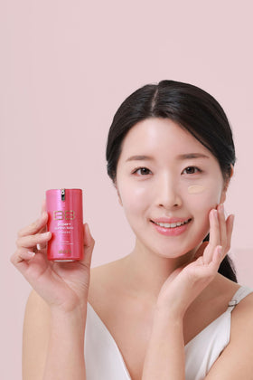 Skin79 Beblesh Balm Pink BB cream swirl on cheek highlights natural finish.