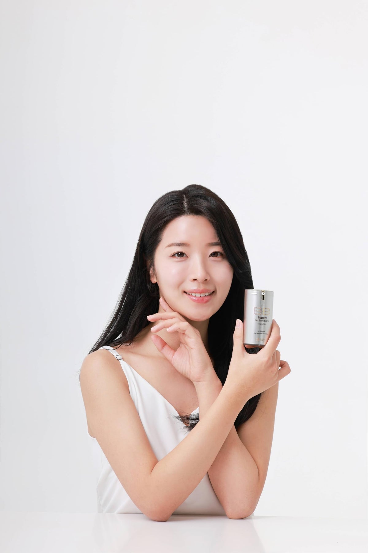 Application on cheek using SKIN79 Gold BB Super Plus Beblesh Balm shows natural color