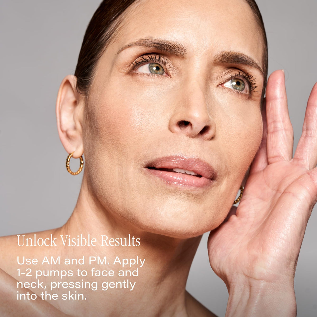 Dropper dispensing SKINN Deep Wrinkle Serum for easy targeted application.