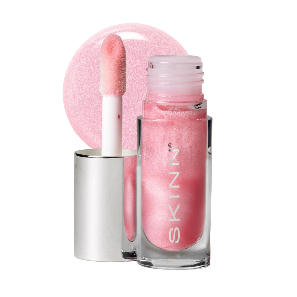 SKINN Luminous Blush Lip Oil with a glossy finish for hydrated, radiant lips.