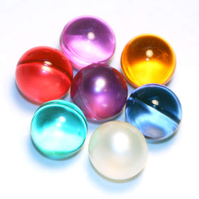 Close-up of SKLEER beads releasing oils for a spa-like bath.
