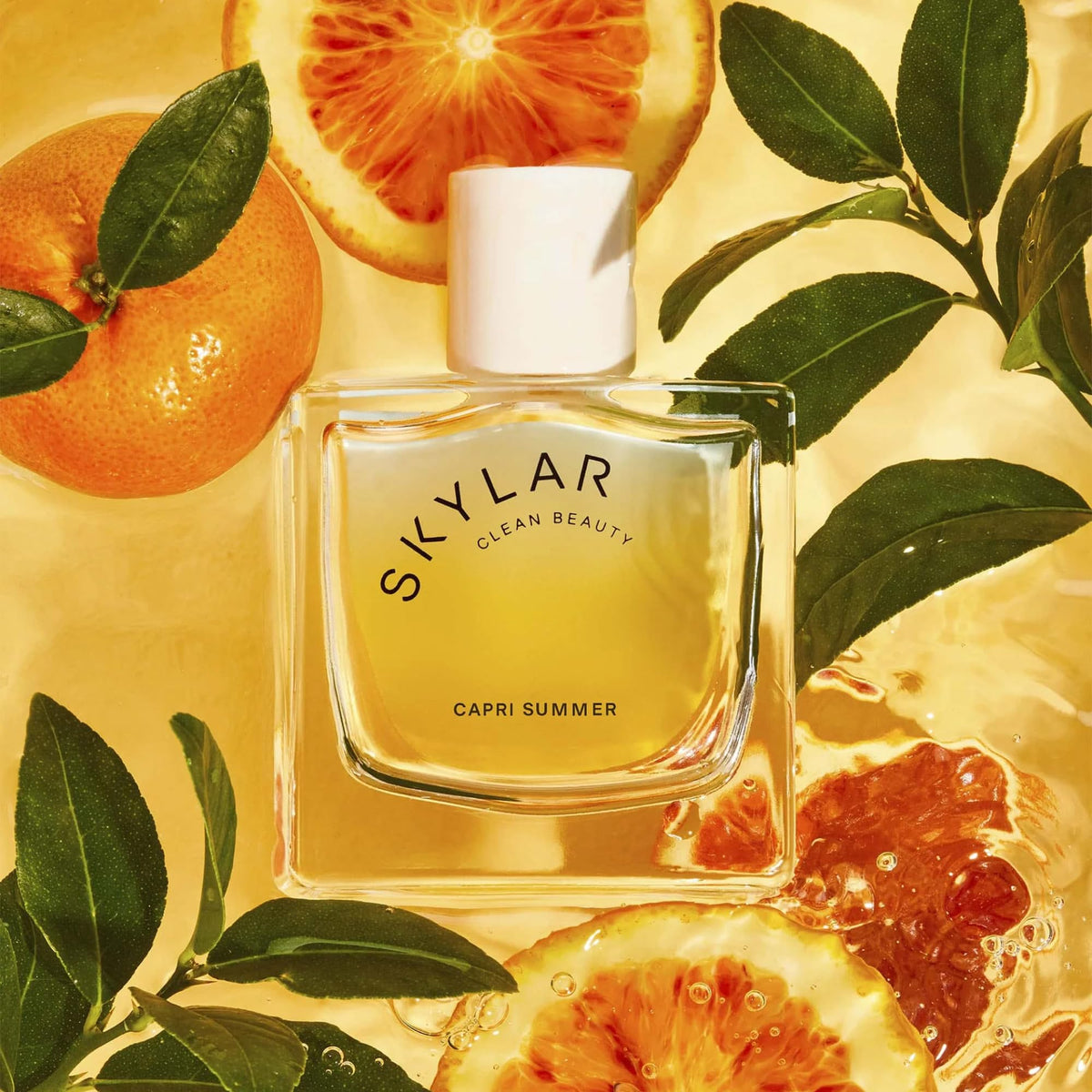 Skylar Capri Summer middle notes reveal neroli and rose warmth.