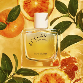 Skylar Capri Summer middle notes reveal neroli and rose warmth.
