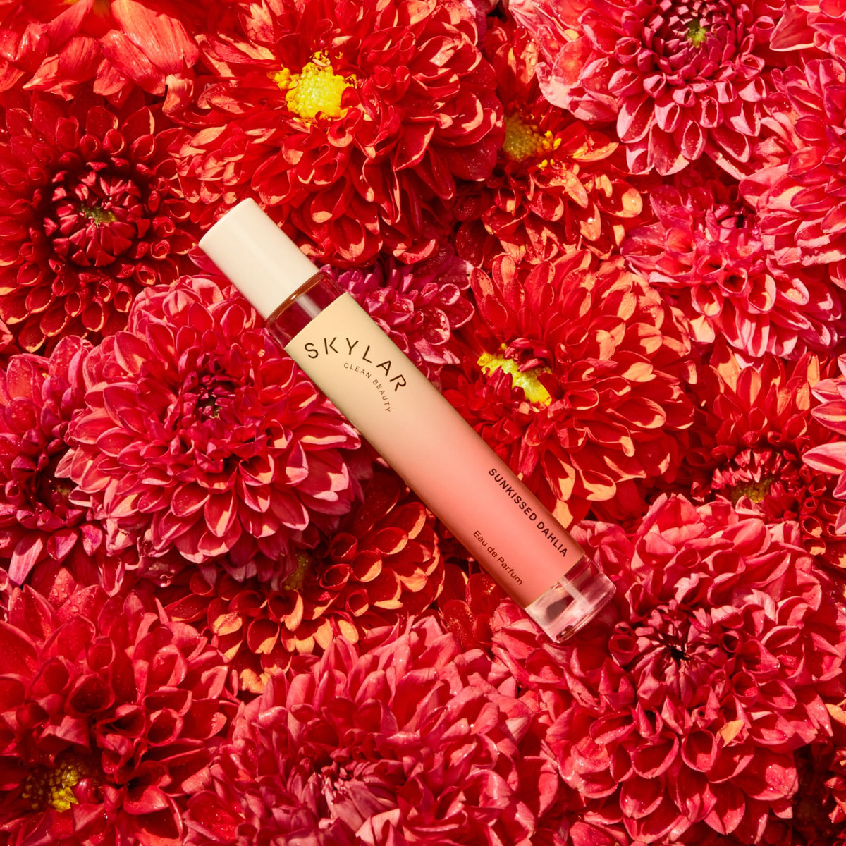 Skylar Sunkissed Dahlia spray-dispersion demonstrating even mist on skin