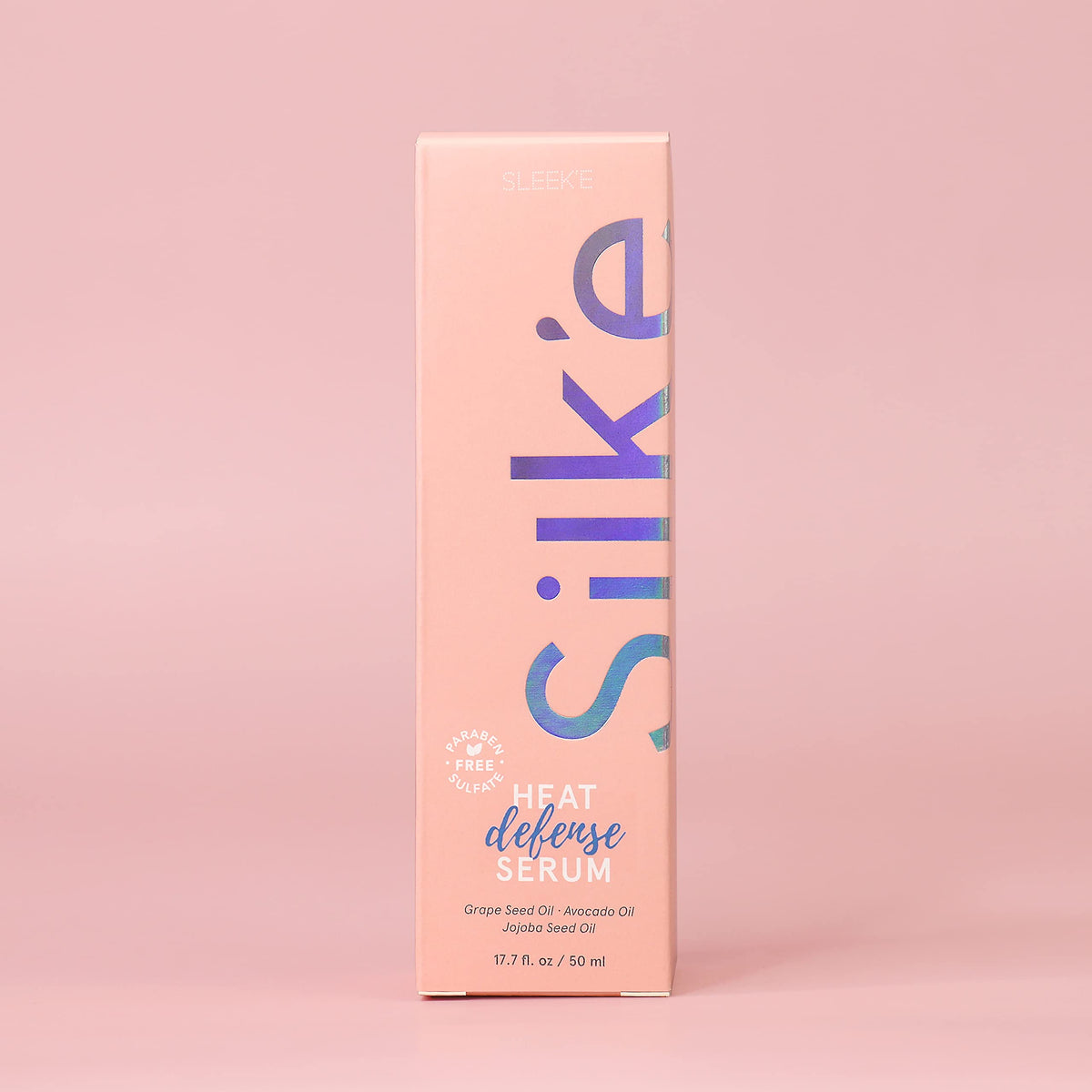 Applying Sleek'e Silk'e serum to damp hair for frizz control and shine