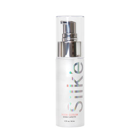 Sleeke Silk'e Serum bottle close-up showing frizz-control benefits.
