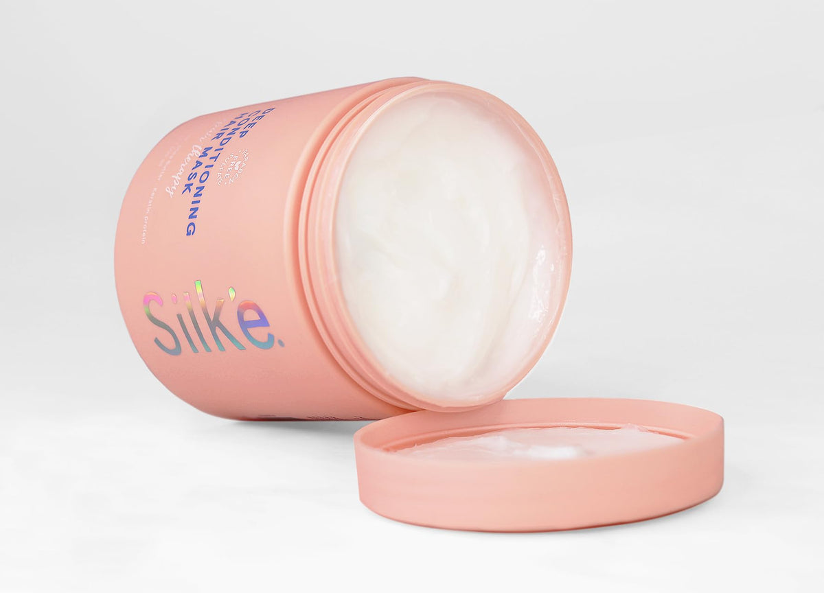 Sleek'e Silk'e Repair Mask bottle pour for deep conditioning of damaged hair.