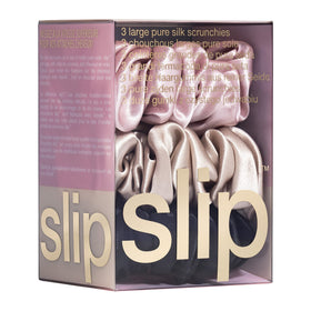 Close-up of the SLIP large silk scrunchie multi-pack showing color variety and texture.
