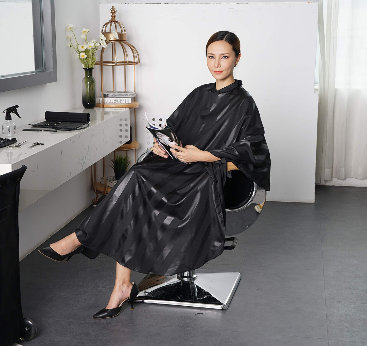 SMARTHAIR cape in action at a barber station demonstrating professional use.