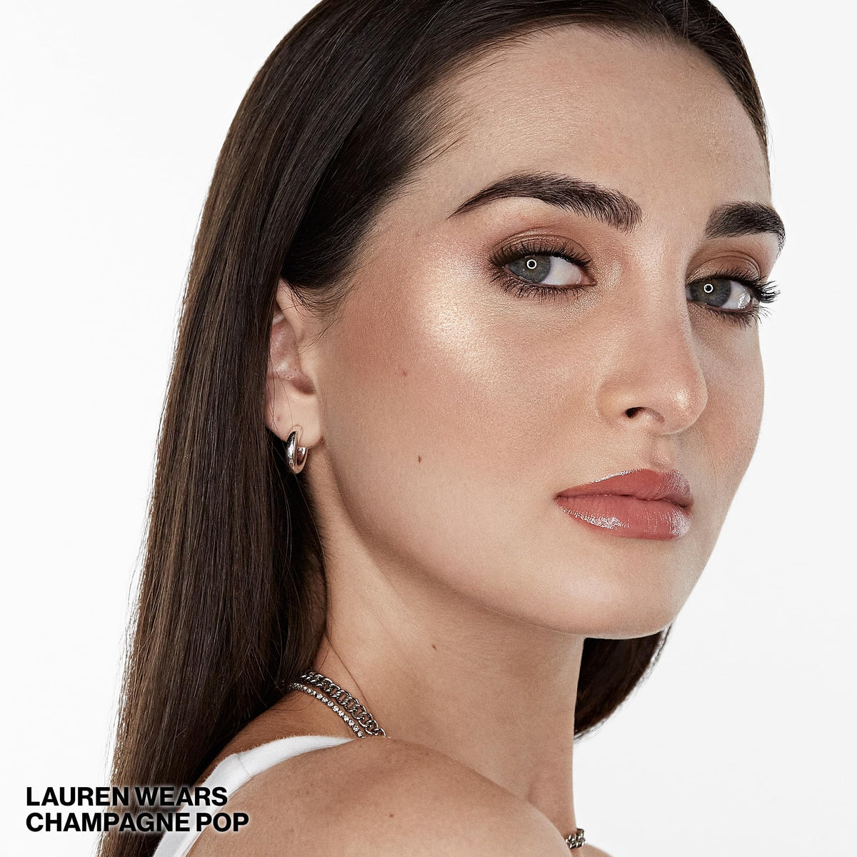 Smashbox BECCA highlighter applied with brush for seamless glow on cheeks
