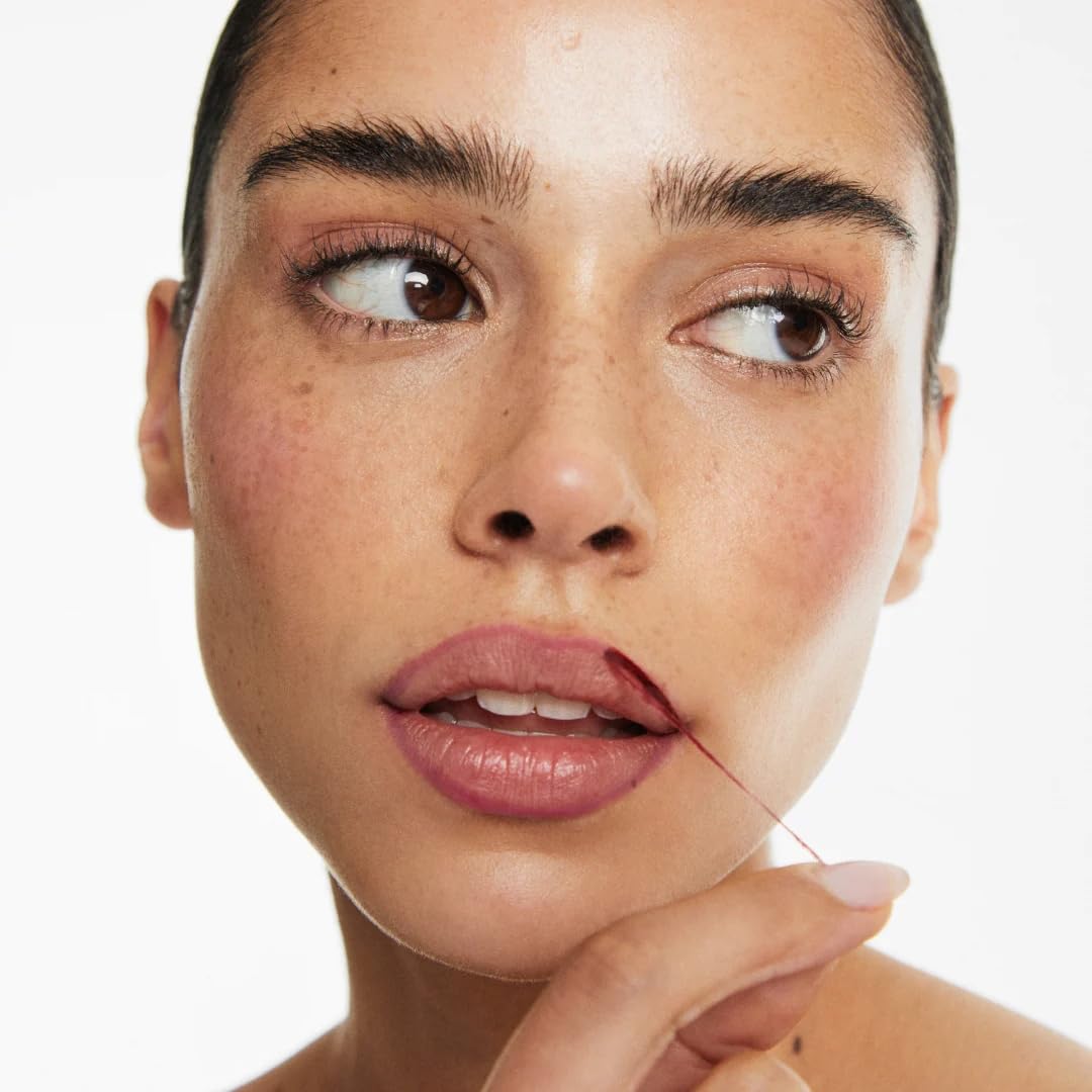 Smooche Lip Stain Watermelon Sugar application closeup showing easy peel-off formula