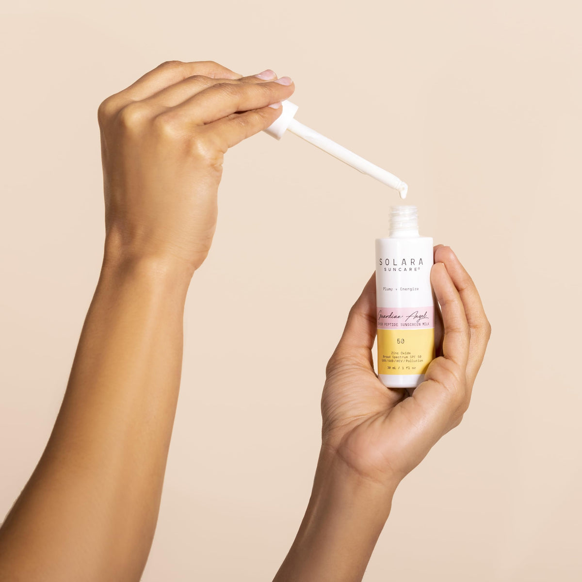 Solara Guardian Angel Sunscreen Milk being applied on the face