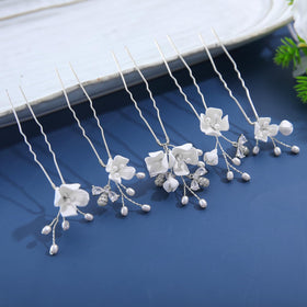 Soulshow silver bridal hair clip detail adds elegant sparkle for bridesmaids' hairstyles.