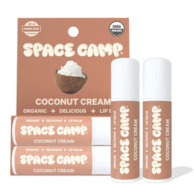Space Camp Wellness jumbo lip balm coconut-cream on lips for lasting hydration.