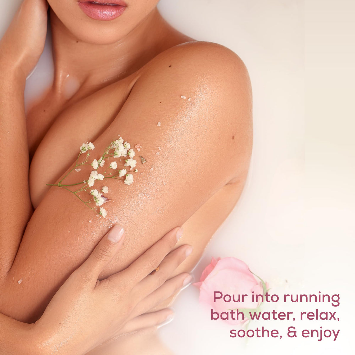 Hands ready a warm bath with SPICE BEAUTY magnesium soak for muscle relief.