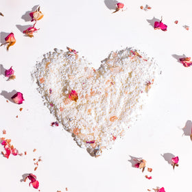 Damask rose petals and oils in SPICE BEAUTY soak for skin hydration.