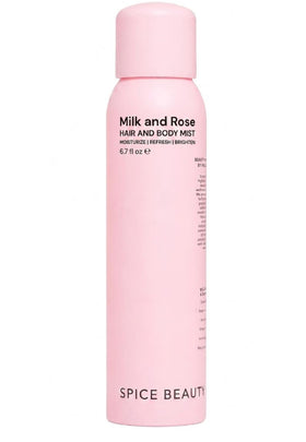SPICE BEAUTY Milk & Rose bottle releasing a light rose mist for hair and skin.