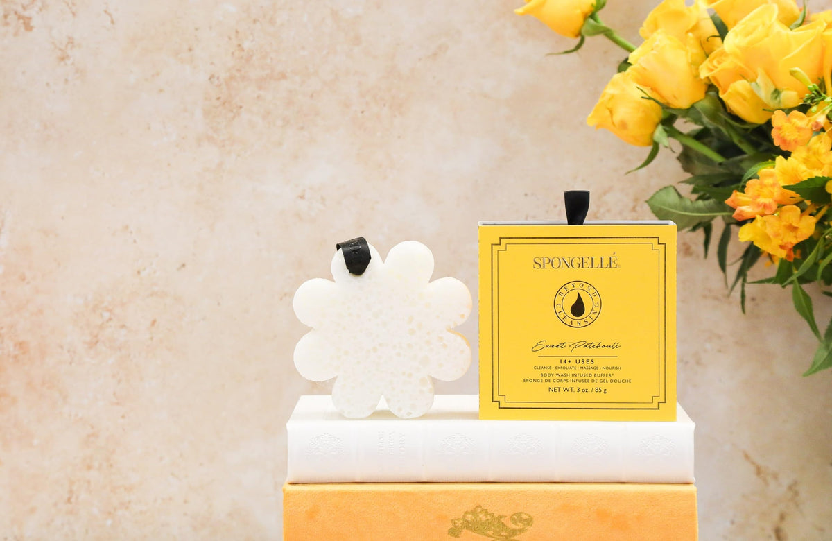 Spongelle exfoliating sponge in use shows gentle scrubbing.