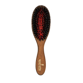 Spornette boar bristle brush with porcupine design gently detangles all hair types.