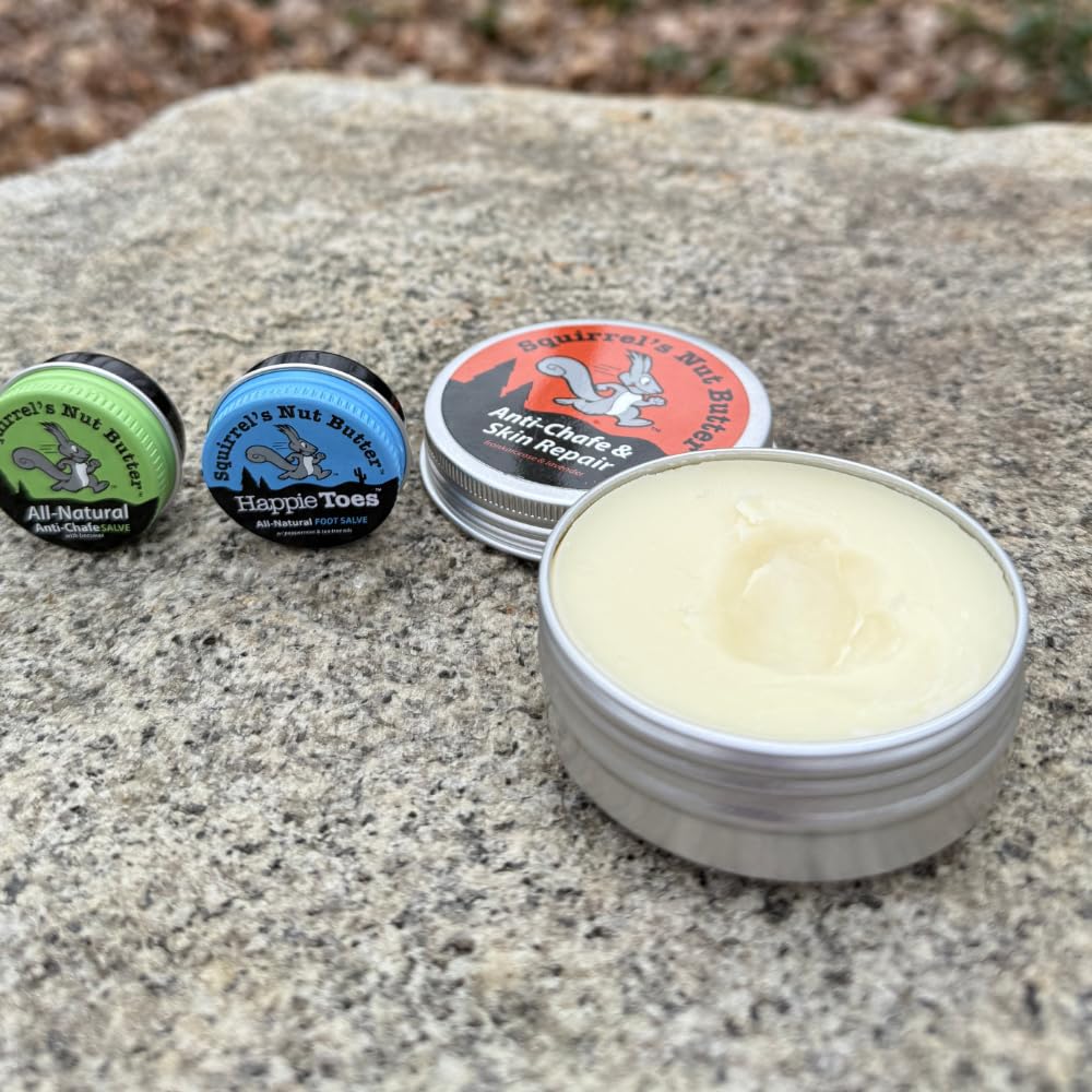 Athlete applies balm on leg during cycling to prevent chafing.