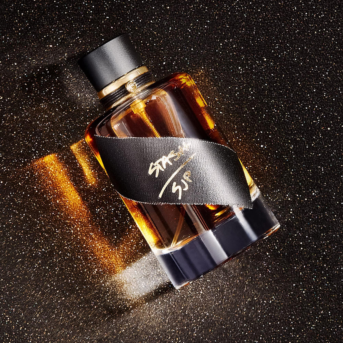 Stash by Sarah Jessica Parker bottle on vanity; elegant design complements modern photos