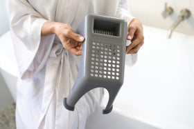 Compact and stackable Easy Reach Foot Rest fits small bathrooms
